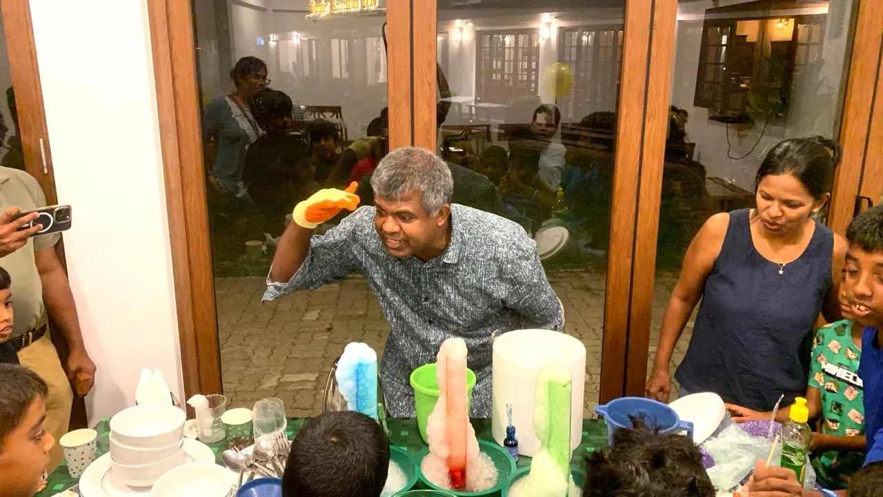 Mr. N presenting a row of erupting foam columns to children at a birthday party